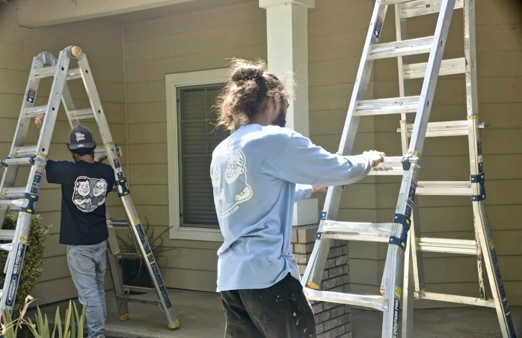 Two Solutionists setting ladders at a San Ramon home