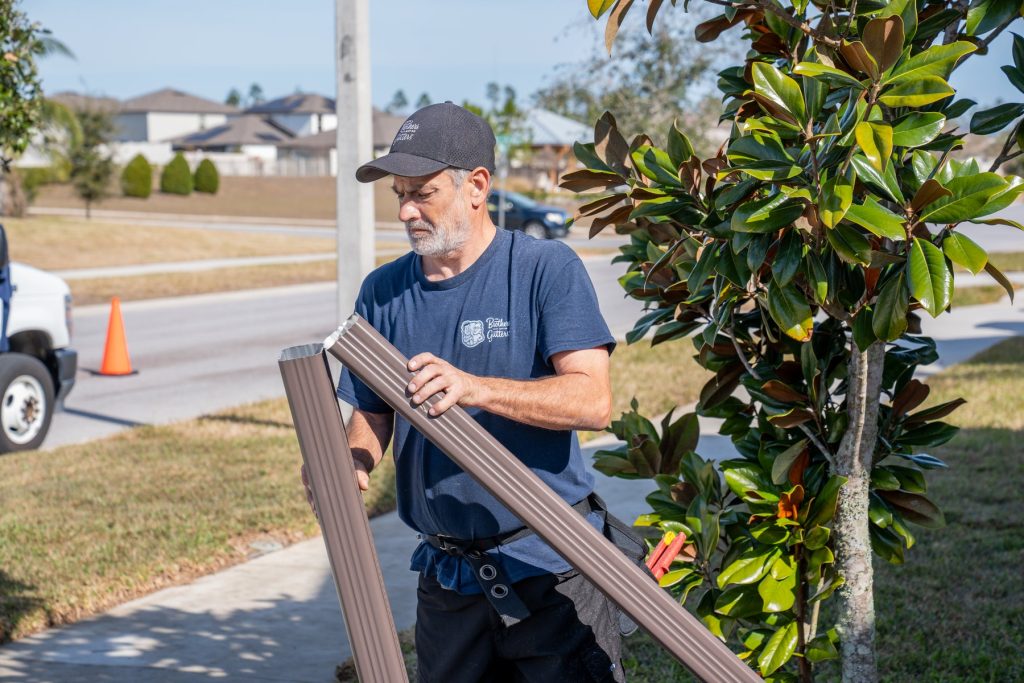 Carrying downspout sections to the house